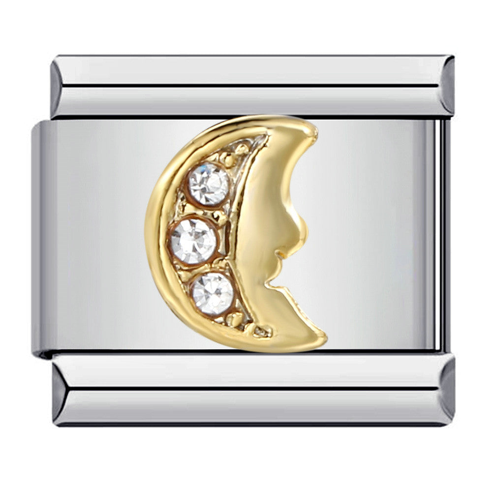 A gold-toned crescent moon with three clear stones on the left side of the moon on a silver-toned Italian charm link