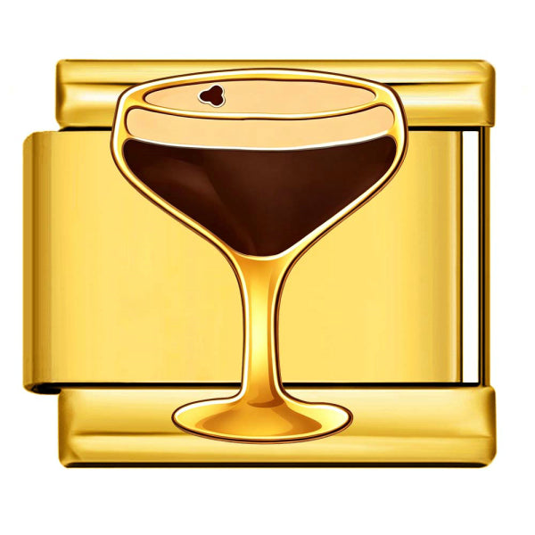 A gold-toned rectangular metal charm or pendant featuring a stylized cocktail glass filled with dark brown liquid on a white background.