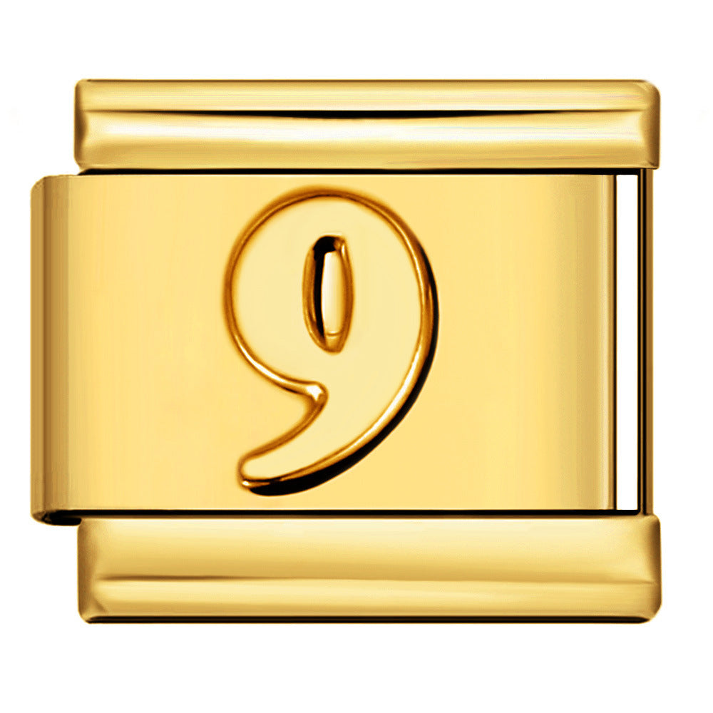 A polished gold-toned metal charm link featuring a raised number '9' on the front