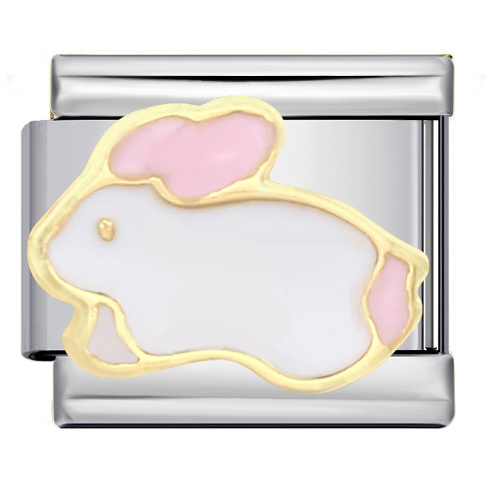 A silver-toned metal charm link featuring a stylized rabbit design with a white enamel fill, pink enamel accents, and a gold-tone outline.