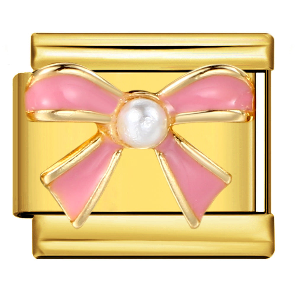 Gold Pink Pearl Bow Italian Charm featuring a glossy pastel pink ribbon bow with gold outlines and a round white pearl center.