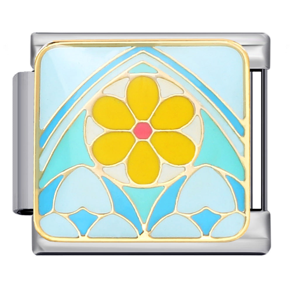 Silver-toned Italian charm link with a bold yellow daisy surrounded by shades of aqua and blue in a geometric design with gold details