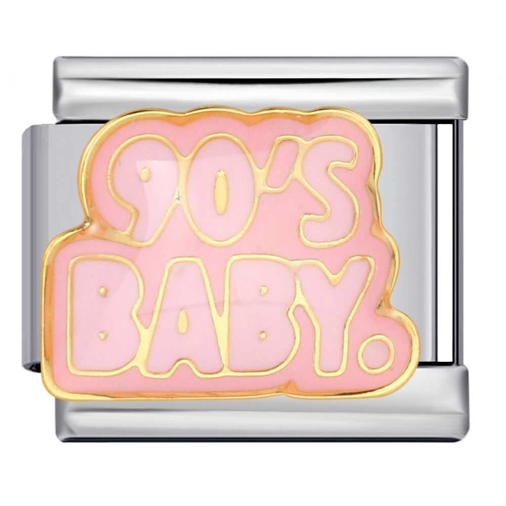 Silver charm with '90's Baby' text on a pink background