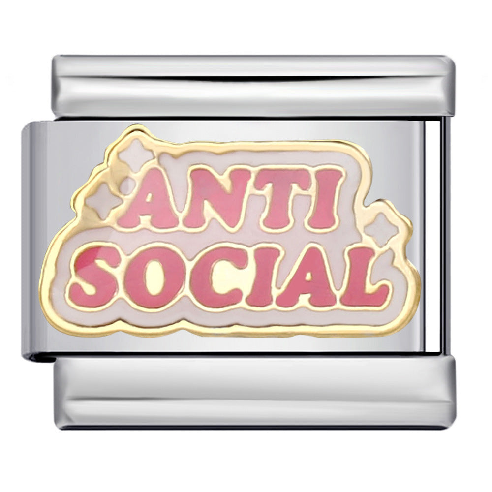 A silver-toned Italian charm link featuring a pink enamel insert with the words 'ANTI SOCIAL' in raised pink letters, outlined in gold and set against a pale pink background.