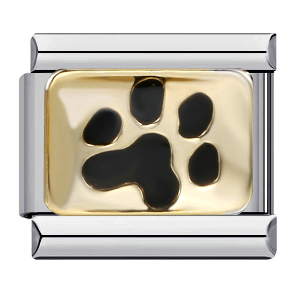 Silver toned charm with a black paw print design on a gold background