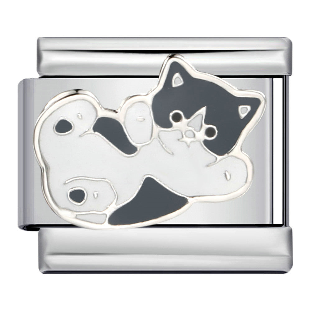 A silver-toned modular charm link featuring an enamel black and white cat