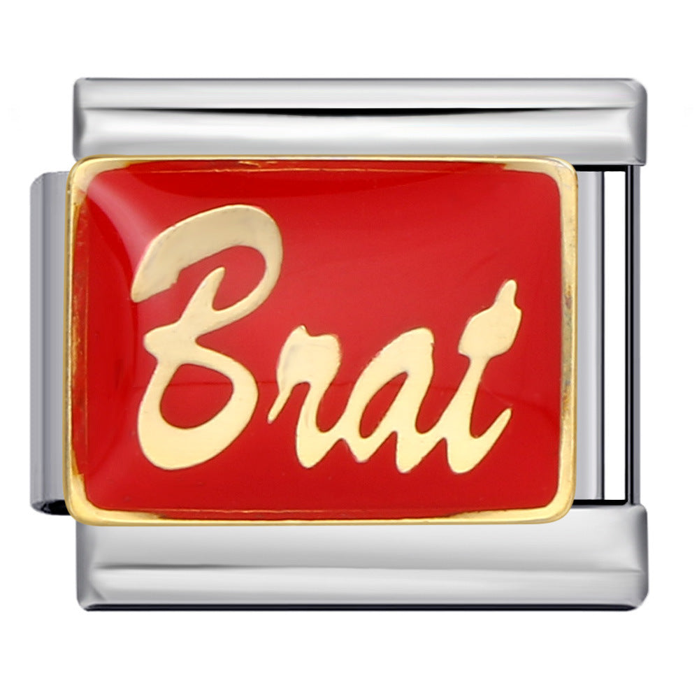Silver-toned charm link with bold gold lettering that says 'Brat' against a bright red background
