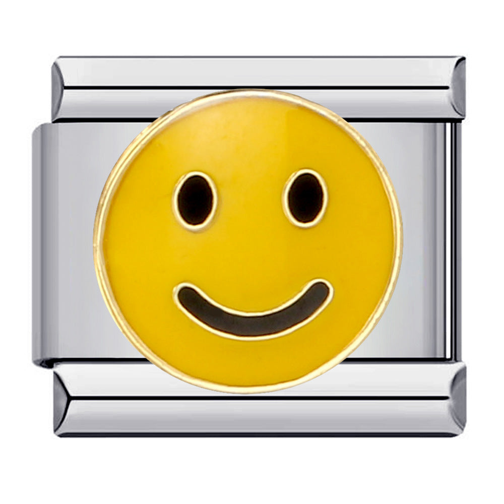 A silver-toned Italian charm link featuring a round yellow smiley face enamel inlay with black eyes and a curved smile.