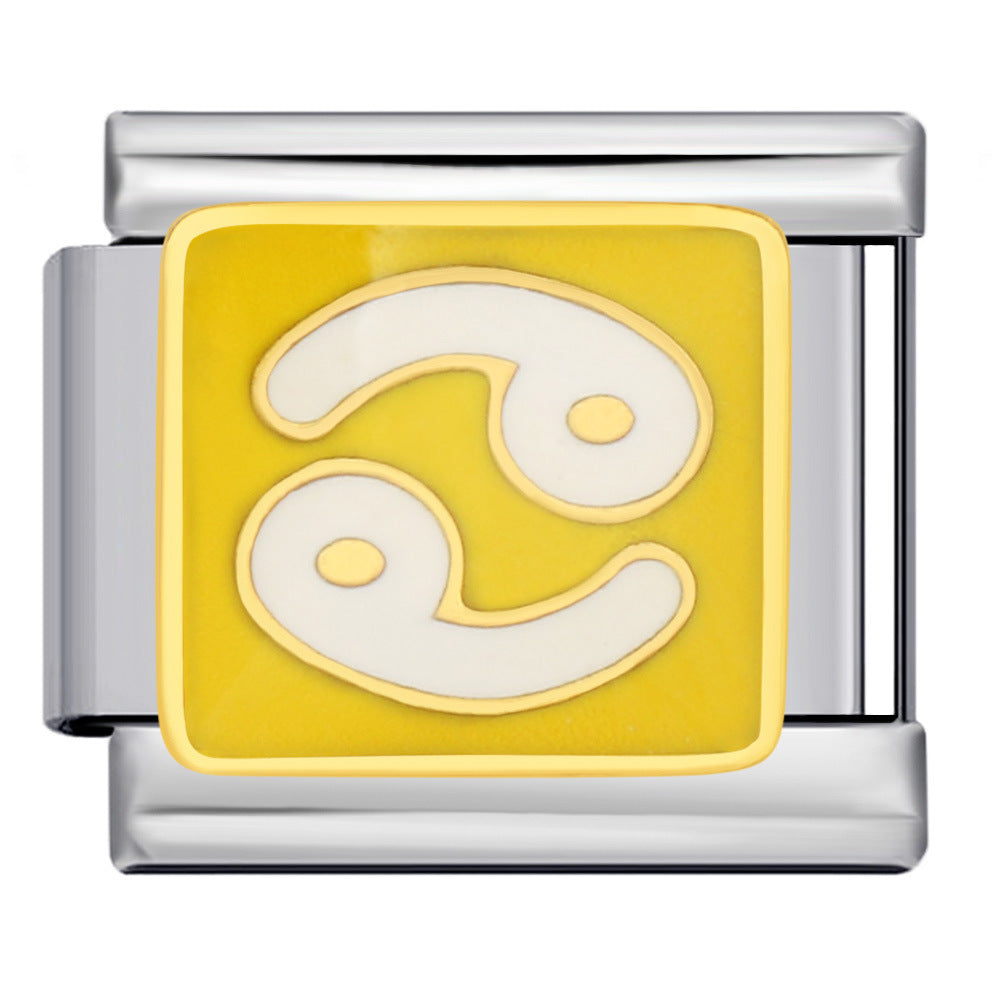 A silver-toned metal charm link featuring a square yellow inlay with a white astrological Cancer symbol resembling a zodiac wheel, shown on a plain yellow background.