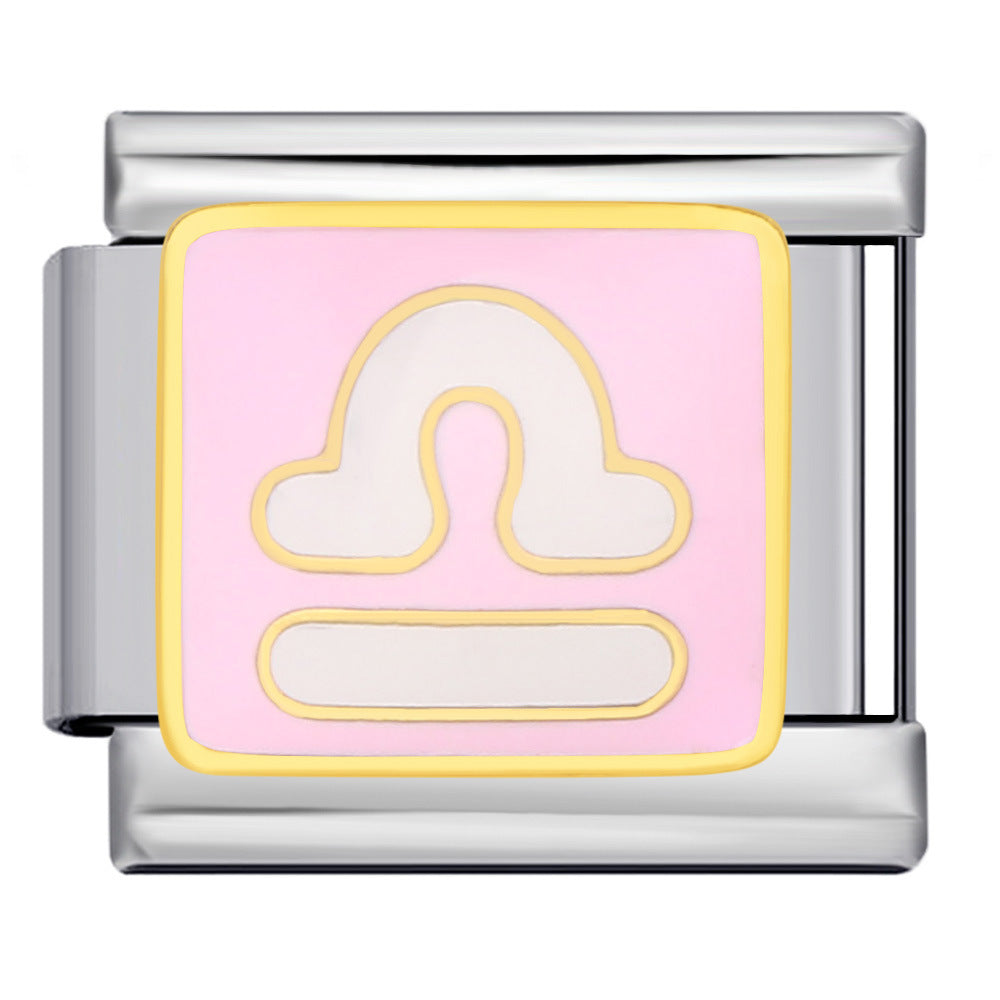 A silver-toned modular Italian charm link featuring a square pink face with a gold border and a white Libra zodiac symbol.