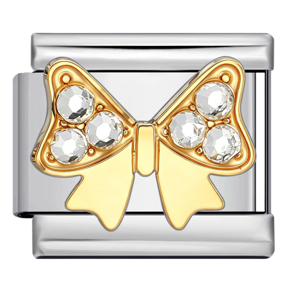 A silver-toned and gold-toned Italian charm link featuring a bow design adorned with four clear faceted crystals