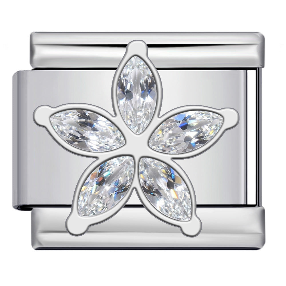 A silver-toned metal charm link featuring a five-petal flower design with marquise-cut clear crystals, shown on a plain background.