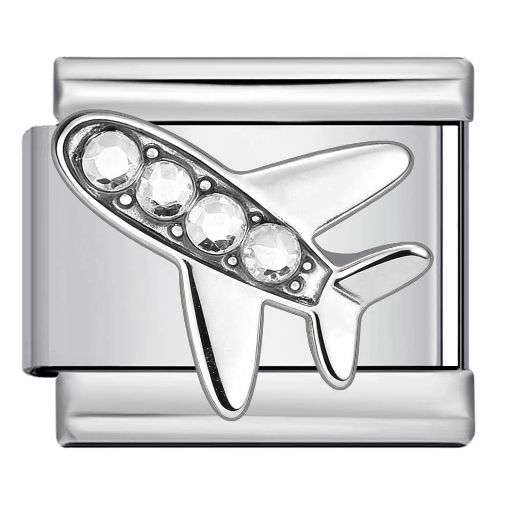 Silver charm with airplane design and clear gemstones