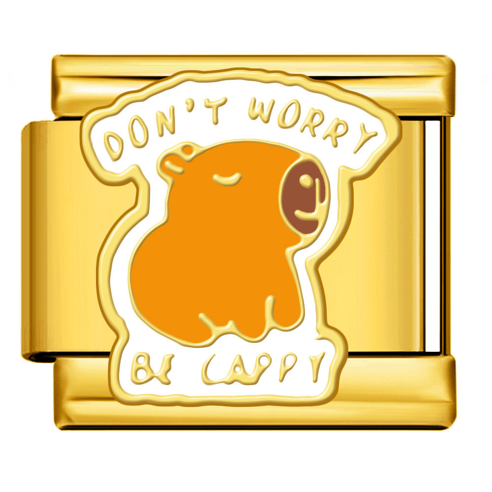 A gold-tone Italian charm link featuring an orange capybara illustration with the text 'DON'T WORRY BE CAPPY' in white enamel.