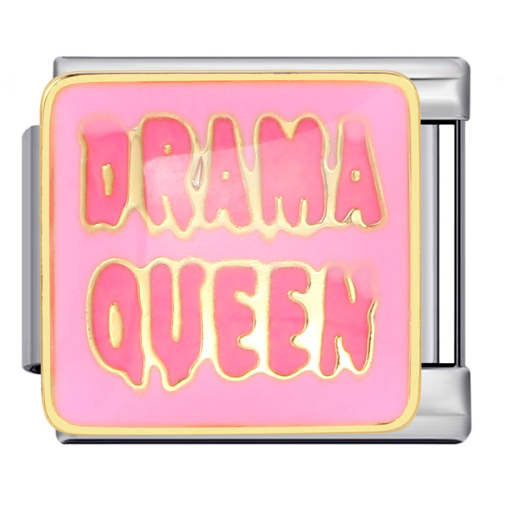 A square charm link featuring a pink enamel face with the words 'DRAMA QUEEN' in dripping pink letters outlined in gold, set in a silver-toned metal frame.