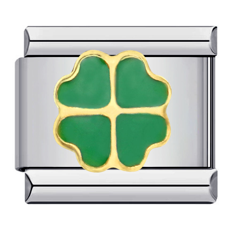 Silver charm with a green four-leaf clover design