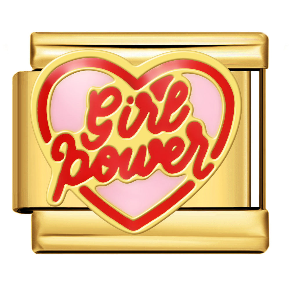 gold toned charm with a red and pink heart that says 'girl power' in a red font with a gold outline