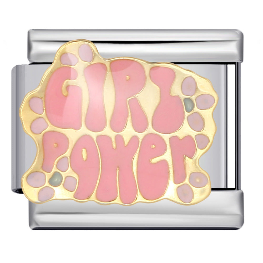 A charm link featuring the words 'GIRL POWER' in pink bubble lettering with a gold outline, set on a silver-toned metal link.