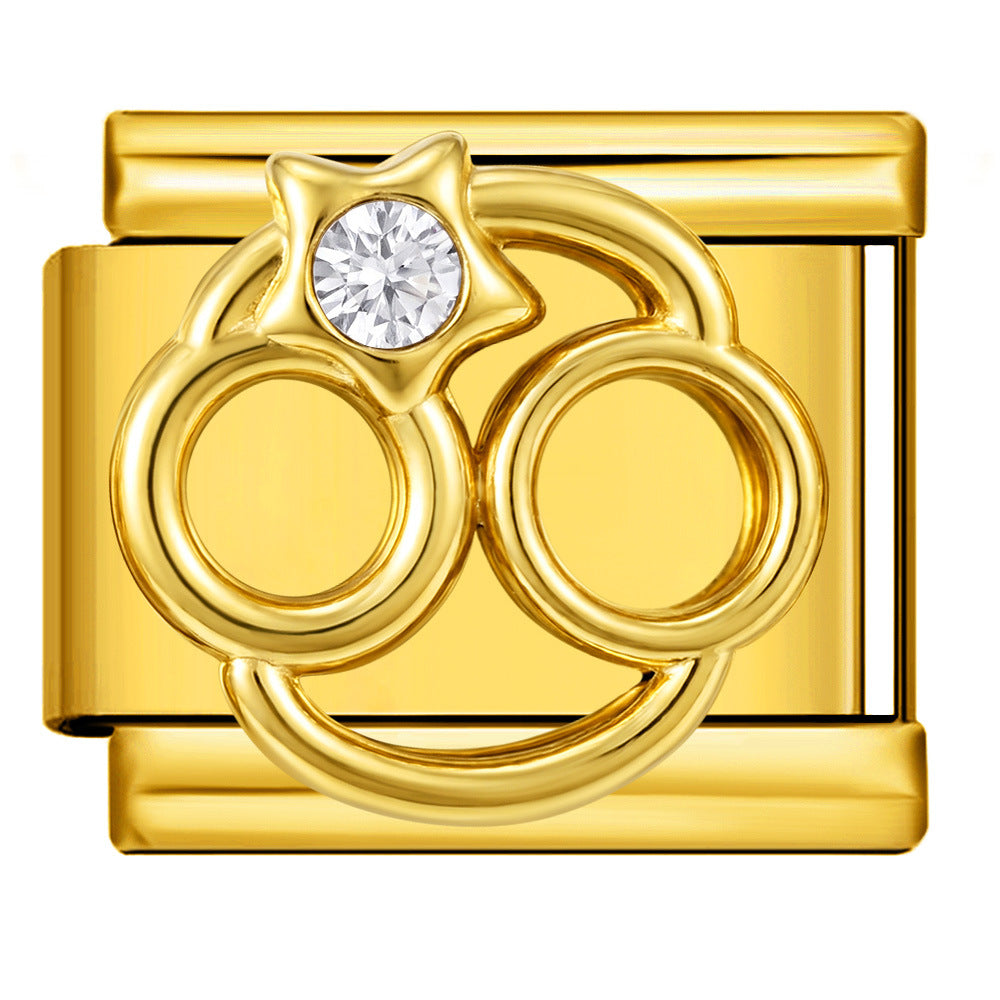 A gold-toned rectangular charm link featuring a Cancer zodiac symbol set with a clear round gemstone
