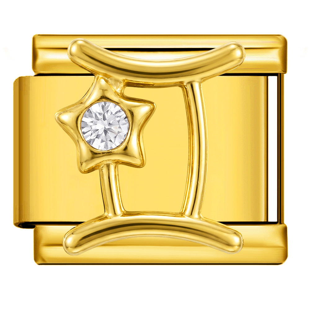 A polished gold-tone charm link featuring the Gemini zodiac symbol with a clear round-cut gemstone at the center