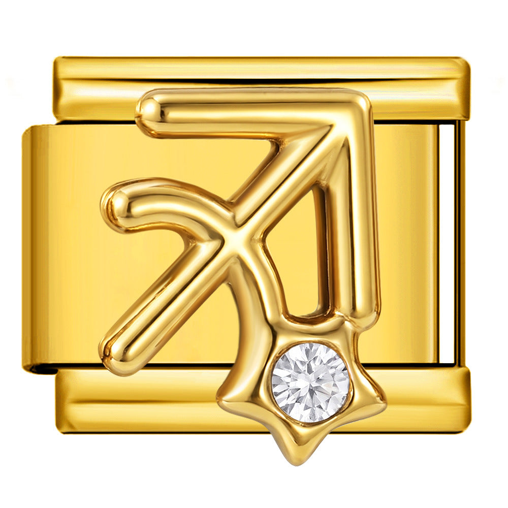 A gold-toned rectangular charm link featuring the Sagittarius zodiac symbol with a clear round gemstone at the bottom