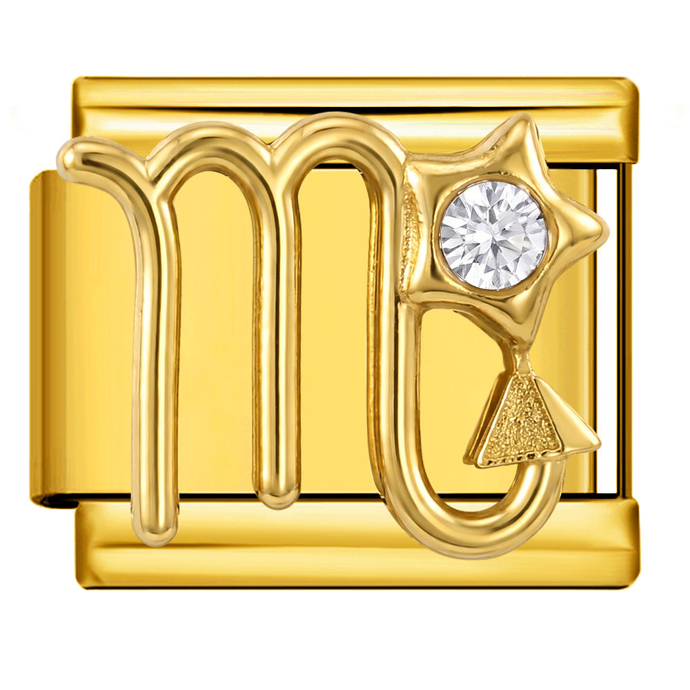 Gold zodiac sign charm for jewelry making, featuring the Scorpio symbol with a clear round gemstone and a small textured gold triangle accent