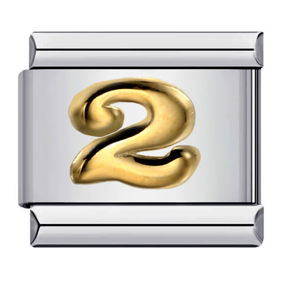 Silver charm with a gold number '2'