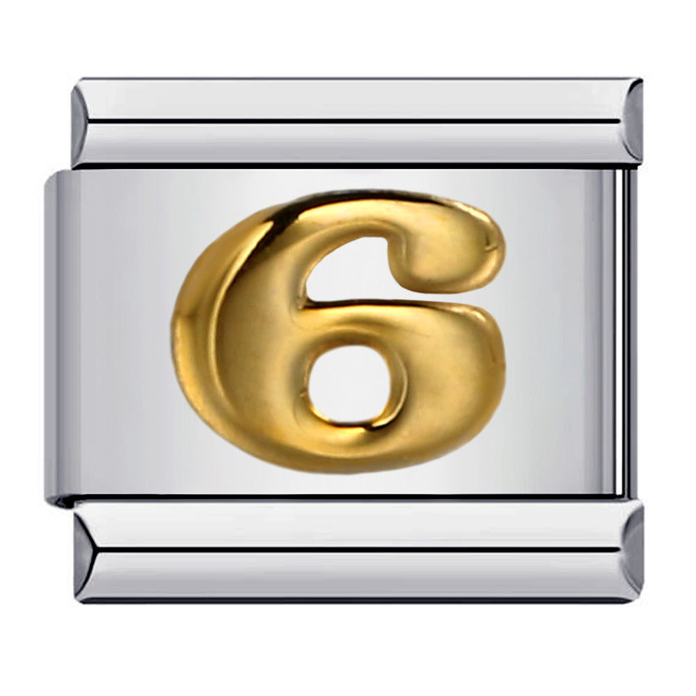 Silver charm with a gold number '6' 