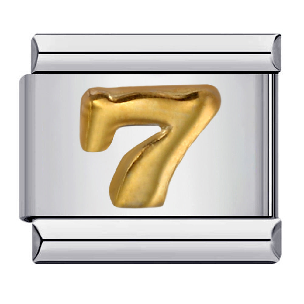Silver charm with a gold number '7' 