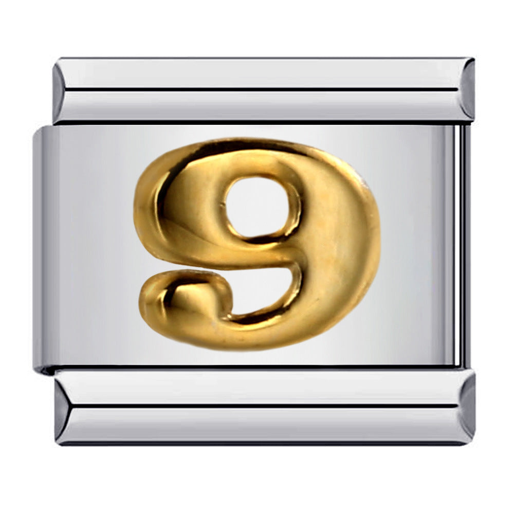 Gold number '9' charm on a silver background
