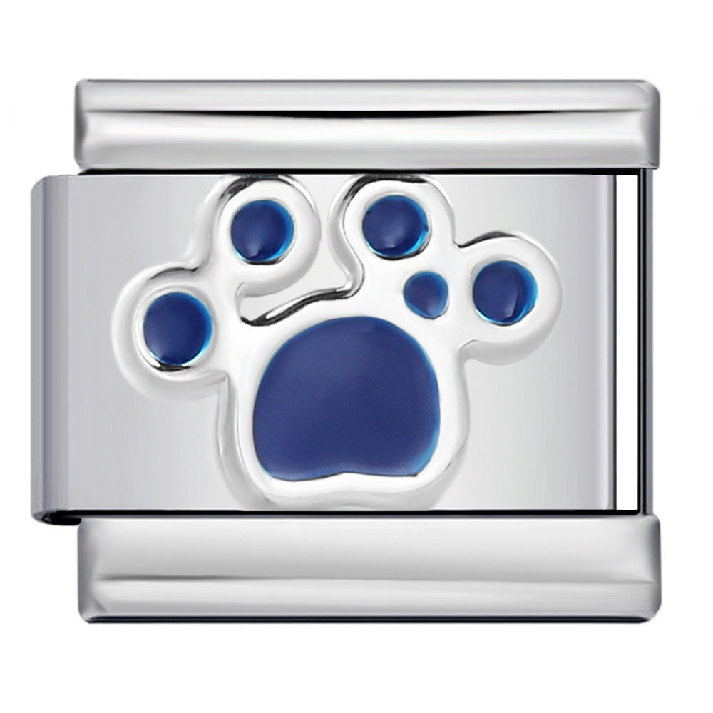 A polished silver-tone Italian charm link featuring a raised paw print design with deep blue enamel fills