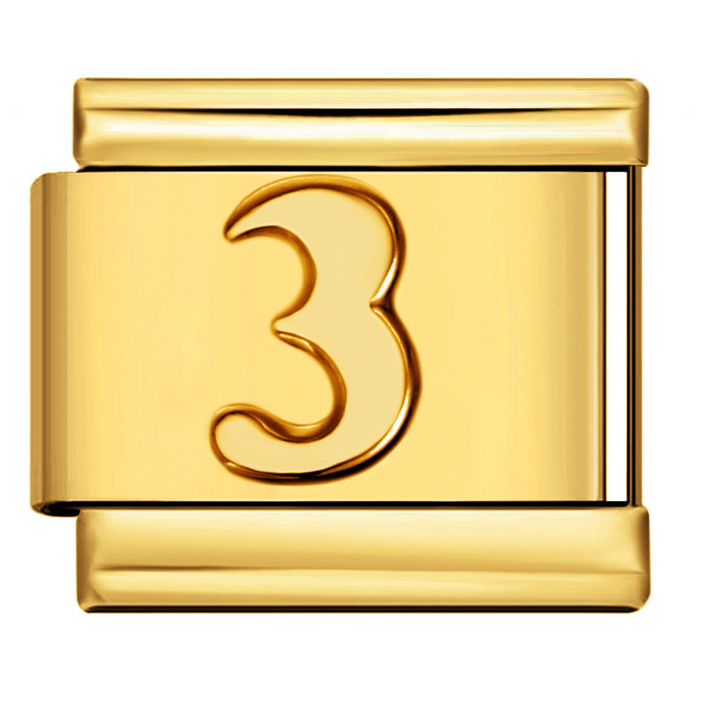 Gold charm with the number '3' in the center