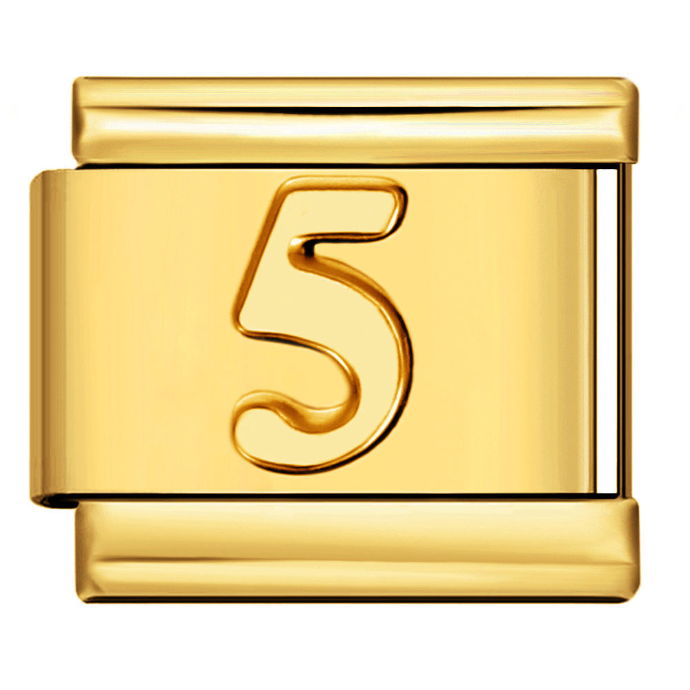 A polished gold-tone metal charm link featuring an embossed stylized number 5 on the front