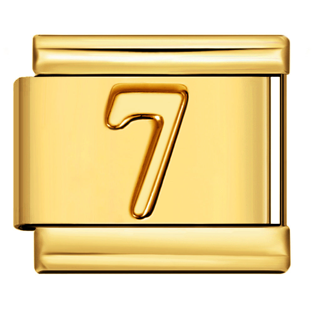 A polished gold-toned rectangular charm link with a raised numeral 7 in the center