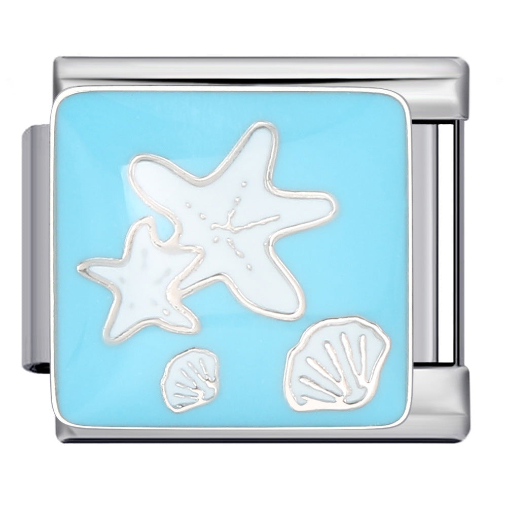 Silver-toned Italian charm link with white starfish and seashells against a bright blue background 