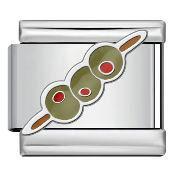 A silver-toned metal charm link featuring an enamel design of three green olives on a skewer with red pimentos and brown wood ends, shown on a plain background.