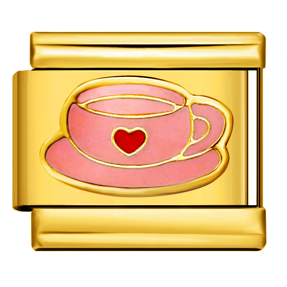 Gold Pink Heart Teacup Italian Charm featuring a pastel pink teacup with a red heart, matching pink saucer, and gold outlines.
