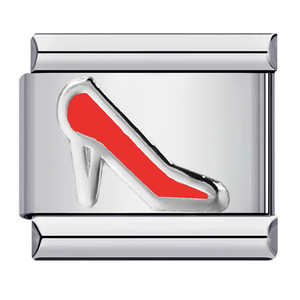A silver-toned rectangular charm link featuring an enamel high-heeled shoe design in red