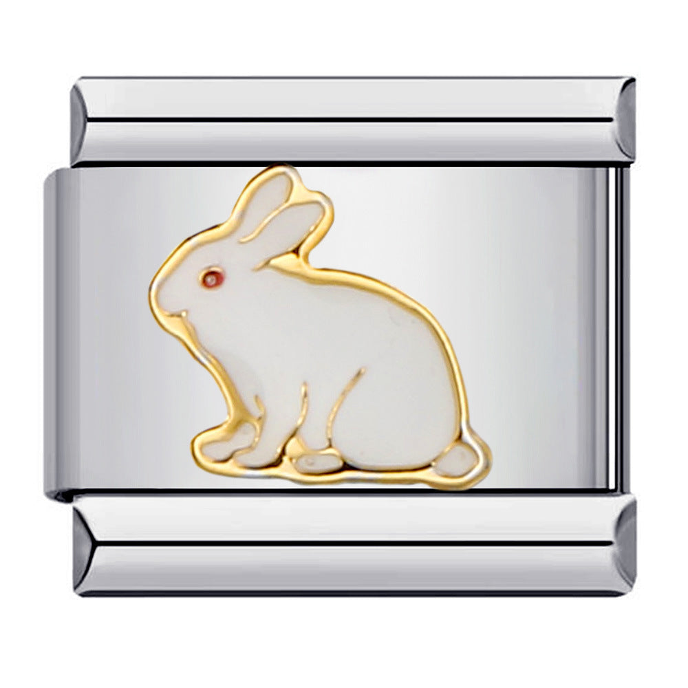 Silver charm with gold and white rabbit design with red eyes