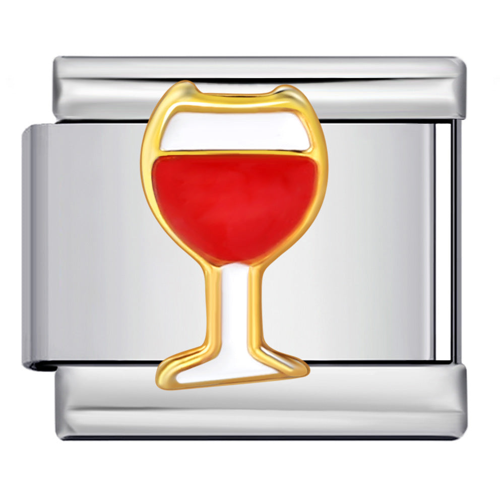 White wine glass with red wine with a gold outline on a silver-toned Italian charm link